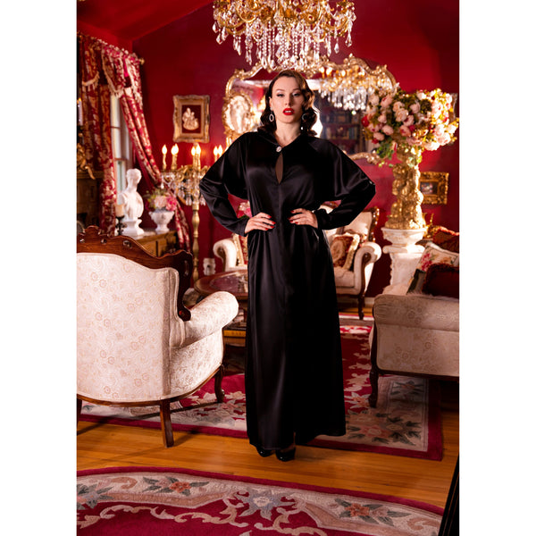 Black satin hooded gown.