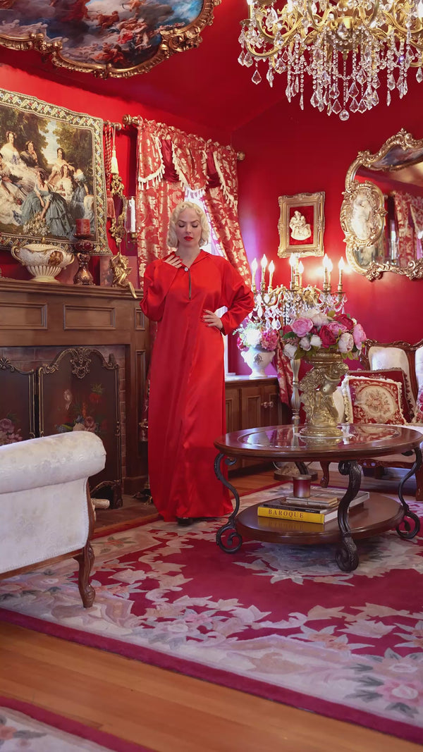 Red satin hooded gown.