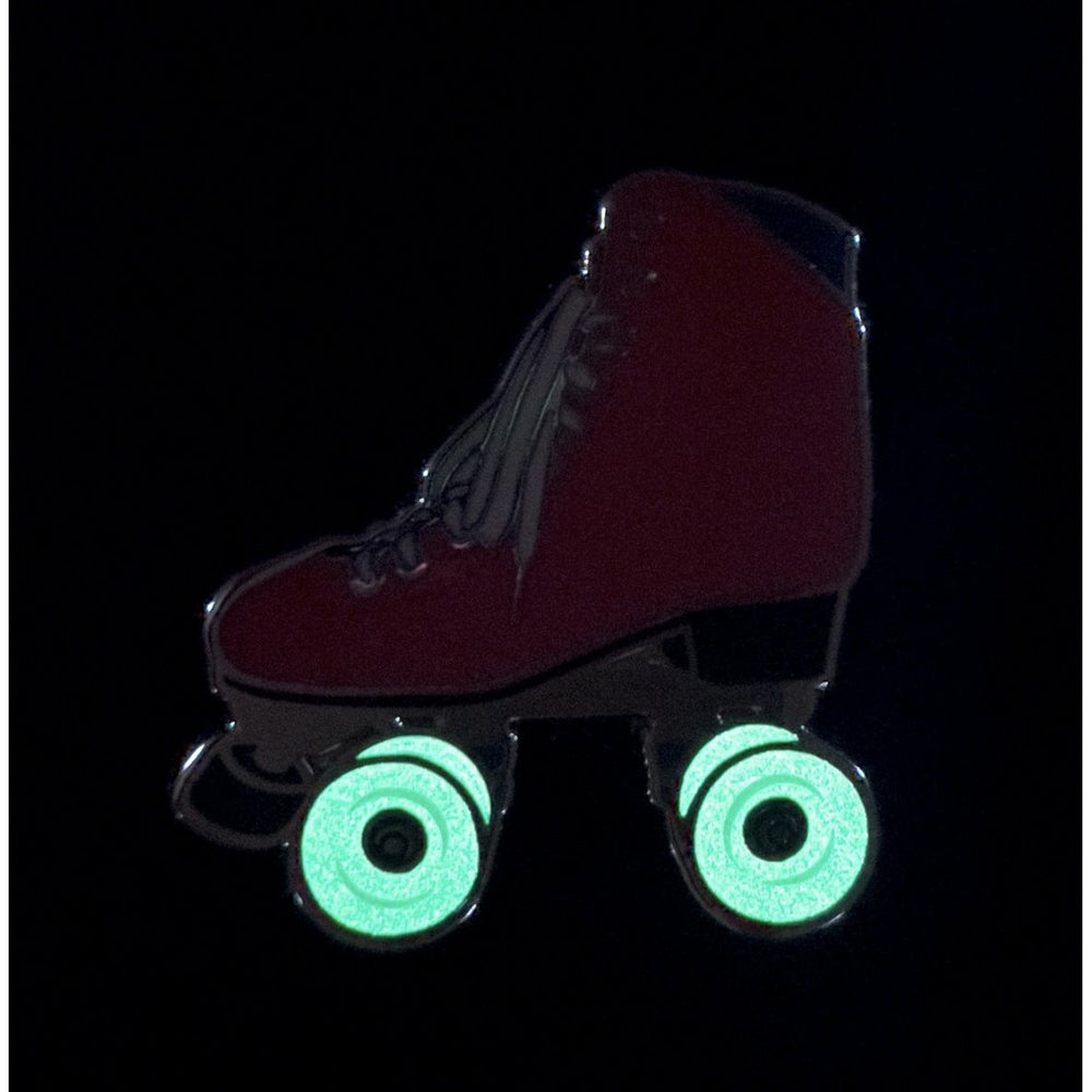 Pink roller skate pin with glow in the dark wheels